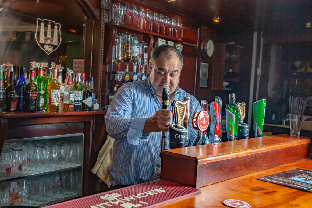 barman club pulling pint